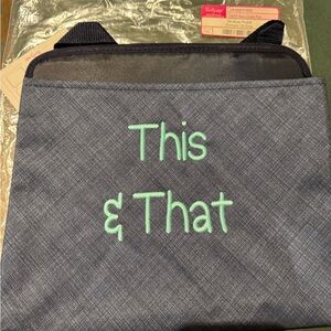 Thirty One Oh Snap pocket. navy in color with This & That embroidered. NWT